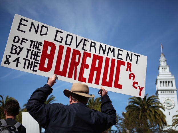 An activist holds a sign during a tax day Tea Party rally in San Francisco.