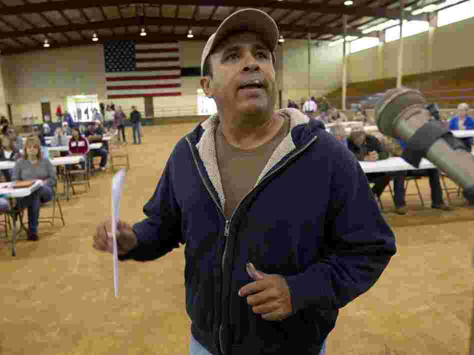 Migrant worker Felipe Chacoa of Mexico talks about his desire to continue to harvest produce during a meeting of farmers and state officials to discuss the impact of the Alabama Immigration law on their livelihoods in Oneonta, Ala.