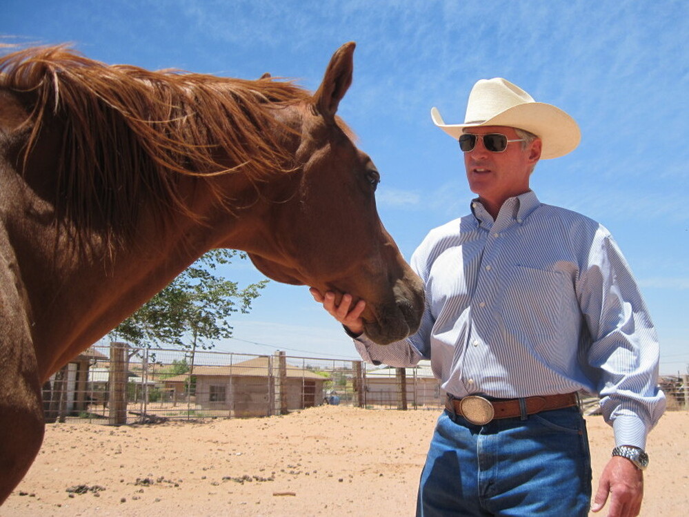 George Hardeen, great-nephew of Harry Houdini, is seen in his corral in Tuba City, Ariz. He was a journalist, a horse trainer, and a spokesman for the former president of the Navajo Nation. Today, he does public relations and still rides horses.