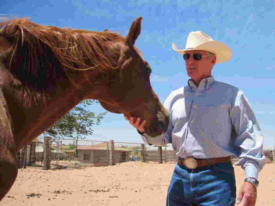 George Hardeen, great-nephew of Harry Houdini, is seen in his corral in Tuba City, Ariz. He was a journalist, a horse trainer, and a spokesman for the former president of the Navajo Nation. Today, he does public relations and still rides horses.