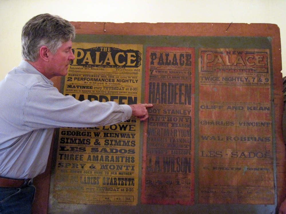 George Hardeen poses with a poster from a 1906 performance by his grandfather, Theo Hardeen. It is the only memento he has of his grandfather. 