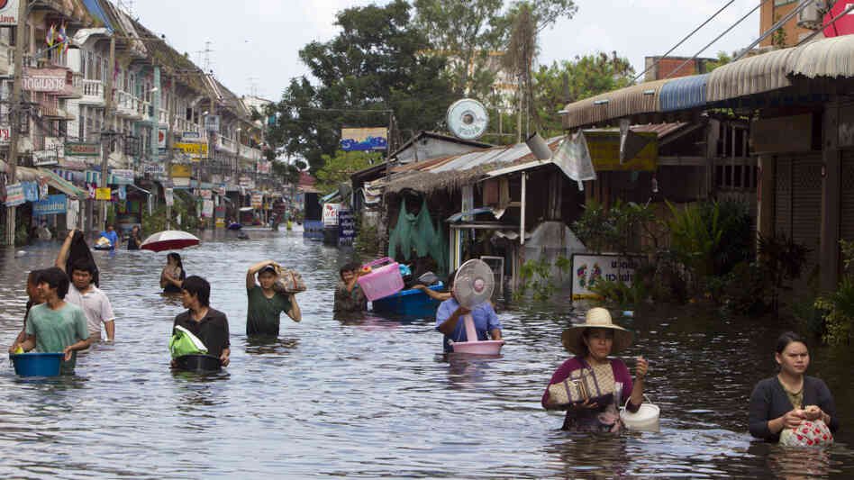 Residents make their way along flooded streets on the outskirts of Bangkok on Saturday. Thailand is experiencing the worst flooding in 50 years. Residents make their way along flooded streets on the outskirts of Bangkok on Saturday. Thailand is experiencing the worst flooding in 50 years.
