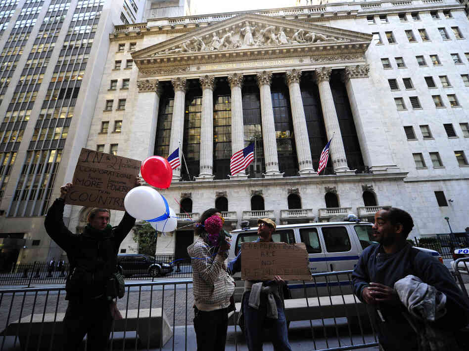 Occupy Wall Street participants demonstrate in front of the New York Stock Exchange in September. The group's press team says the point of the protests is to address the public and not CEOs, whose headquarters have left Wall Street.