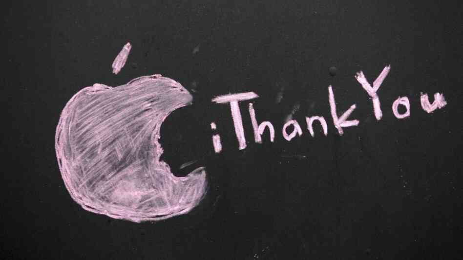 A message honoring Steve Jobs is scrawled on a blacked-out window at an Apple store in Seattle.