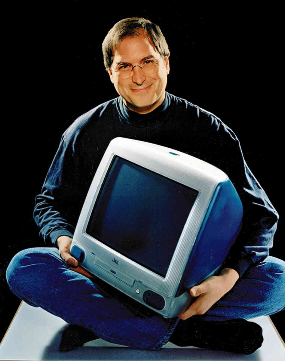 Apple CEO Steve Jobs poses with an iMac in 1998. Apple CEO Steve Jobs poses with an iMac in 1998.