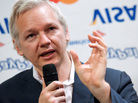 WikiLeaks founder Julian Assange stood in front of a selection of inverted banking company logos as he spoke to journalists today in London. WikiLeaks founder Julian Assange stood in front of a selection of inverted banking company logos as he spoke to journalists today in London.