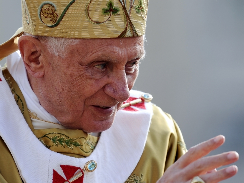 Pope Benedict XVI waves to pilgrims before a beatification Mass of three new saints in St. Peter's Square at the Vatican this month.