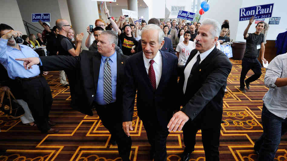 Republican presidential candidate Ron Paul is escorted to a ballroom to speak to his supporters during the California Republican Party Convention this September in Los Angeles. The Texas congressman was once a small-town doctor who specialized in delivering babies. Republican presidential candidate Ron Paul is escorted to a ballroom to speak to his supporters during the California Republican Party Convention this September in Los Angeles. The Texas congressman was once a small-town doctor who specialized in delivering babies.