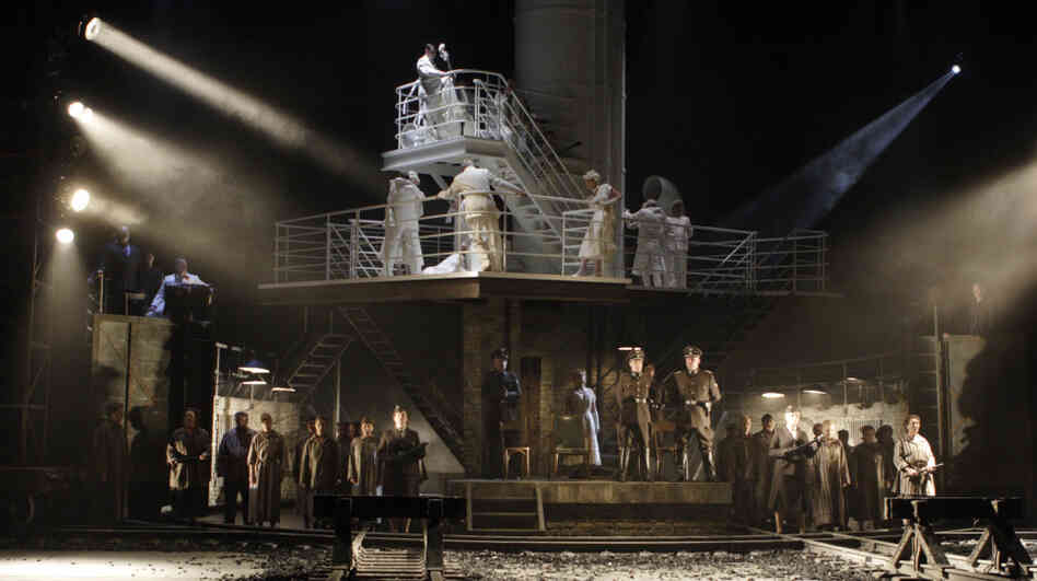The Passenger is staged to juxtapose Auschwitz during the Holocaust — on the lower stage — with a chance encounter on the upper level years later. The Passenger is staged to juxtapose Auschwitz during the Holocaust — on the lower stage — with a chance encounter on the upper level years later.