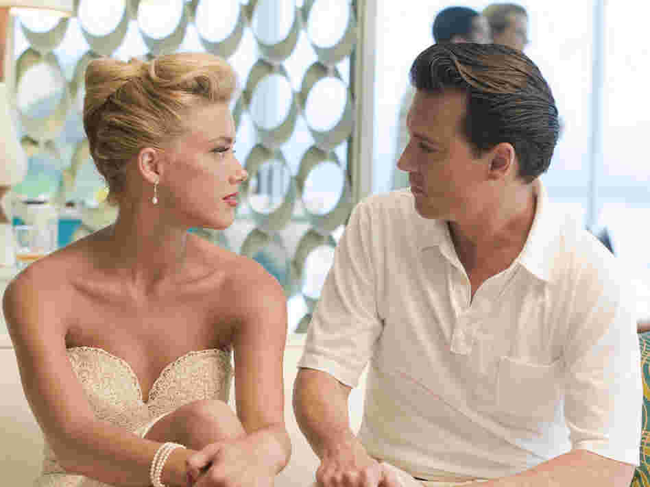 Flirtatious beauty Chenault (Amber Heard) catches Kemp's eye when he visits the beachfront mansion of a local businessman. 