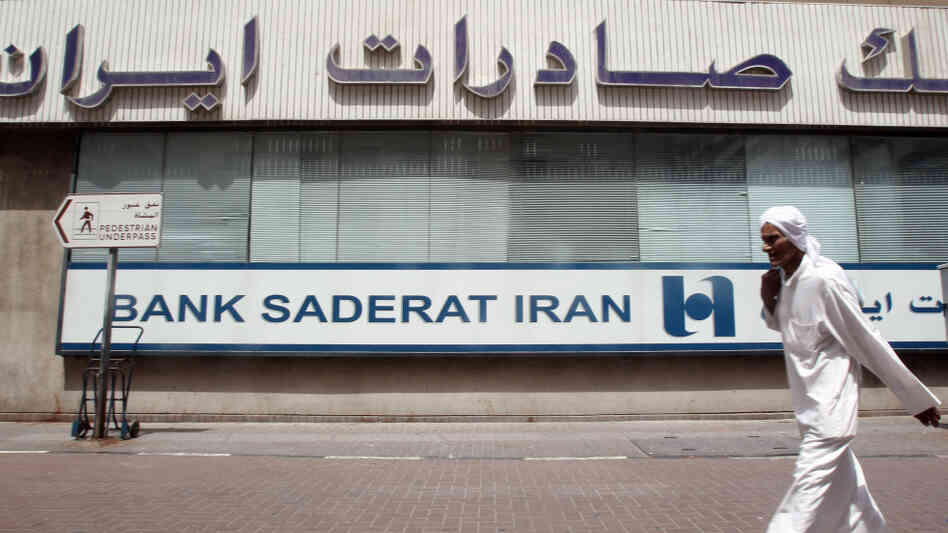 A man walks past a branch of Iran's Bank Saderat in Dubai, in the United Arab Emirates. An estimated $2.6 billion has been stolen from Bank Saderat and other leading Iranian banks, causing a growing scandal. A man walks past a branch of Iran's Bank Saderat in Dubai, in the United Arab Emirates. An estimated $2.6 billion has been stolen from Bank Saderat and other leading Iranian banks, causing a growing scandal.