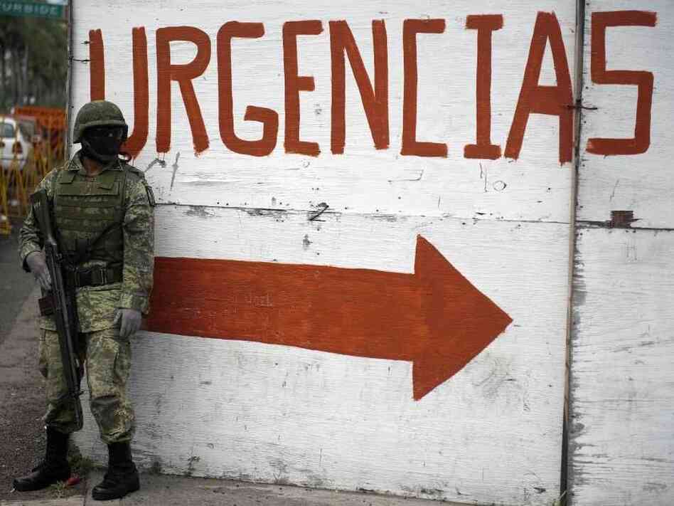 A Mexican soldier takes position near the Regional Hospital of Veracruz earlier this month. The armed forces patrol the streets of the port city in an attempt to combat rising drug violence.