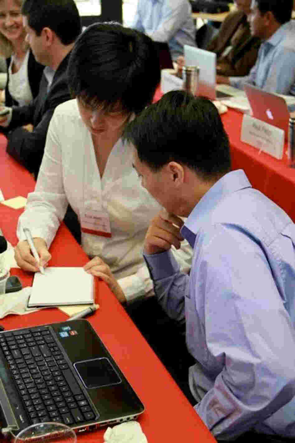 Ellis Meng and Tuan Hoang, researchers from the University of Southern California, brainstorm as part of their Innovation Corps course. Their project is an implantable device for drug delivery, connected by a wireless network to let physicians remotely track the patients' progress.