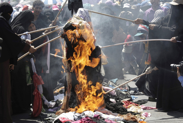 Protesting Yemeni women burn their veils, during a demonstration demanding the resignation of Yemeni President Ali Abdullah Saleh in Sanaa, Yemen.