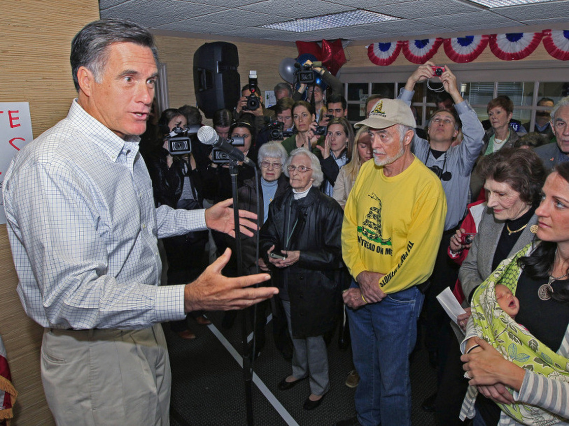 Former Massachusetts Gov. Mitt Romney speaks to a group of supporters during a visit Tuesday to a GOP phone bank in Terrace Park, Ohio. 