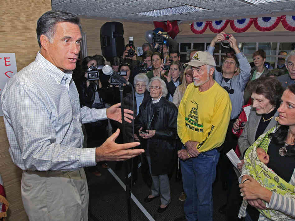 Former Massachusetts Gov. Mitt Romney speaks to a group of supporters during a visit Tuesday to a GOP phone bank in Terrace Park, Ohio. 