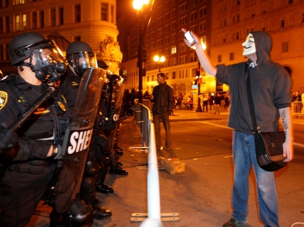Tuesday in Oakland: An Occupy protester and police.