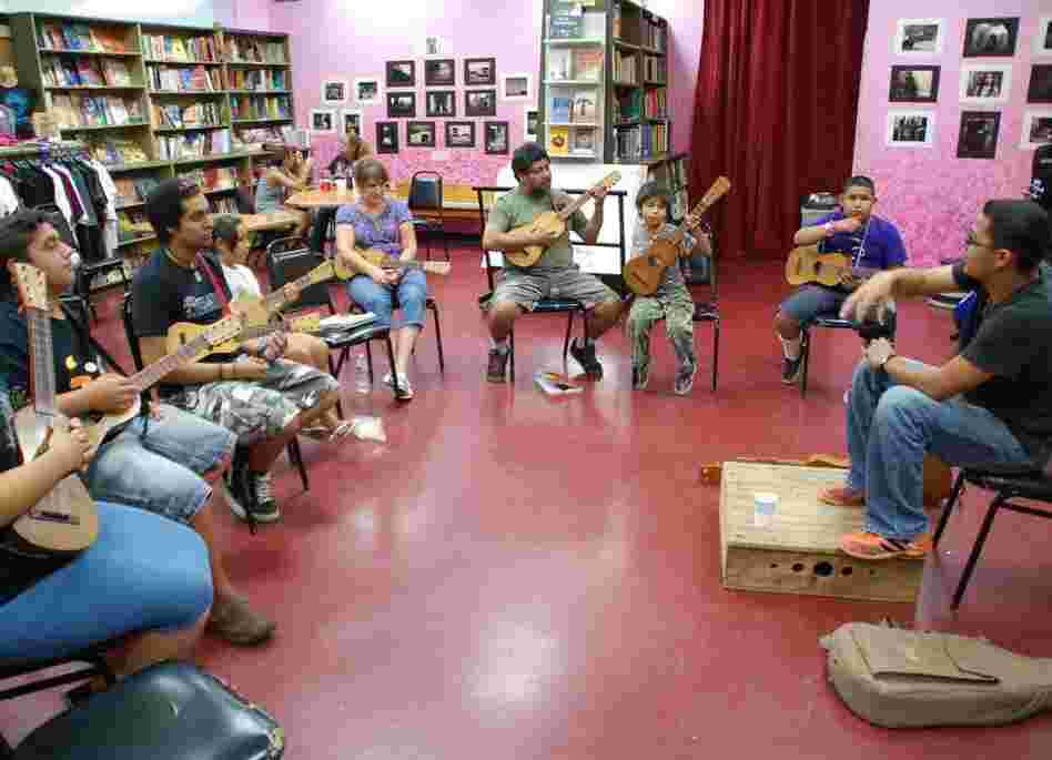 Students learn the jarana in a Son Jarocho class at Tia Chucha's Centro Cultural & Bookstore in Sylmar, Los Angeles. Students learn the jarana in a Son Jarocho class at Tia Chucha's Centro Cultural & Bookstore in Sylmar, Los Angeles.