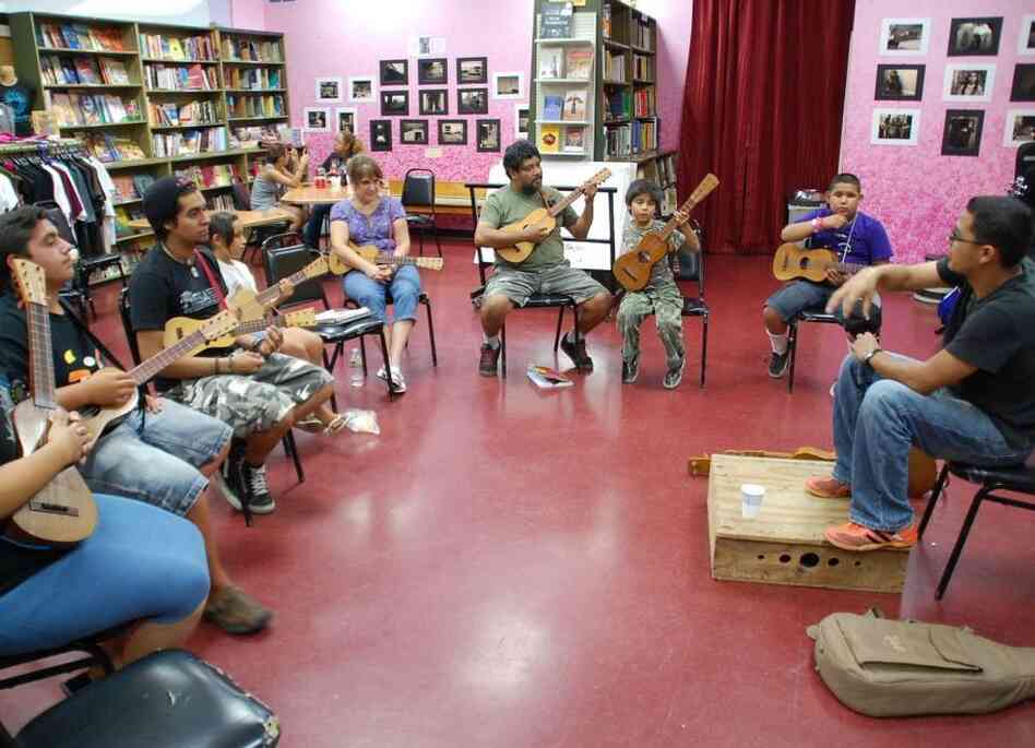Students learn the jarana in a Son Jarocho class at Tia Chucha's Centro Cultural & Bookstore in Sylmar, Los Angeles. Students learn the jarana in a Son Jarocho class at Tia Chucha's Centro Cultural & Bookstore in Sylmar, Los Angeles.