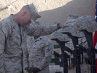 Lt. Col. Jason Morris pays his respects at a memorial service in Sangin, Afghanistan, on Nov. 26, 2010, for three Marines who were killed: Lance Cpl. Brandon Pearson, Lance Cpl. Matthew Broehm and 1st Lt. Robert Kelly. Morris commanded a battalion in volatile Helmand province that suffered the highest casualty rate of any Marine unit in the Afghanistan War. Lt. Col. Jason Morris pays his respects at a memorial service in Sangin, Afghanistan, on Nov. 26, 2010, for three Marines who were killed: Lance Cpl. Brandon Pearson, Lance Cpl. Matthew Broehm and 1st Lt. Robert Kelly. Morris commanded a battalion in volatile Helmand province that suffered the highest casualty rate of any Marine unit in the Afghanistan War.