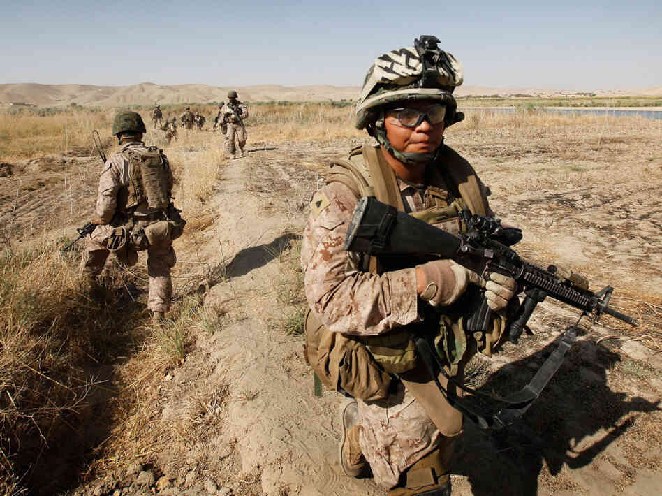 Cpl. Marcus Chischilly patrols near Forward Operating Base Zeebrugge in October 2010, near Kajaki, Afghanistan. This photo was taken a day before he stepped on an IED, losing his left leg and suffering other shrapnel damage.
