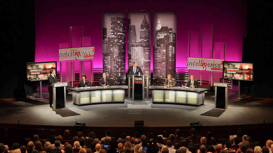 Experts face off during an Intelligence Squared U.S. debate Oct. 25 on the motion "Congress Should Pass Obama's Jobs Plan — Piece By Piece."