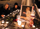 A photograph of Iraq War veteran Scott Olsen is seen Thursday at a vigil. Olsen was severely injured during a standoff between police and protesters in Oakland, Calif., two days earlier. He remains hospitalized. A photograph of Iraq War veteran Scott Olsen is seen Thursday at a vigil. Olsen was severely injured during a standoff between police and protesters in Oakland, Calif., two days earlier. He remains hospitalized.