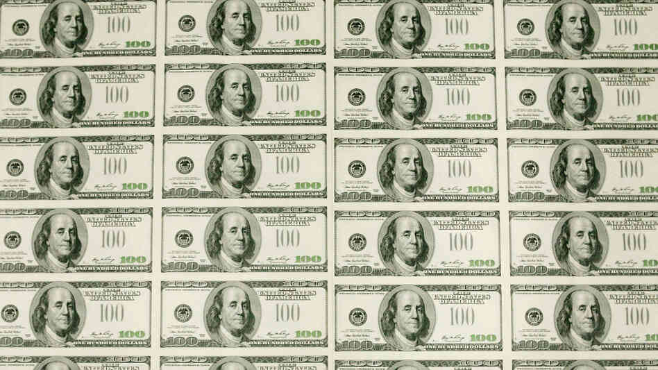Sheets of $100 bills wait to be cut into singles at the Bureau of Engraving and Printing in Washington, D.C. In recent decades, the gap between rich and poor has widened in the United States.