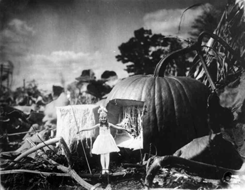 "Photomontage of a fairy standing outside of her pumpkin home, Detroit, Mich., circa 1928"
