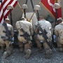 Marines with 3rd Battalion, 5th Marine Regiment, kneel before battlefield memorials for their fallen brothers during a farewell ceremony, Oct. 30, 2010.