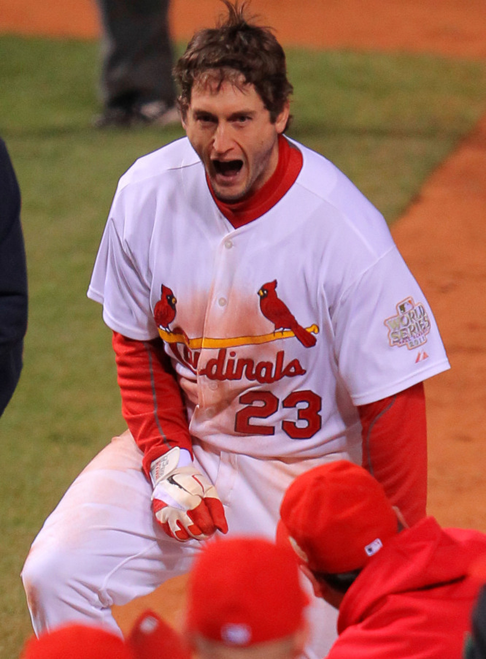 David Freese of the St. Louis Cardinals celebrates at home plate after hitting a walk-off solo home run in the 11th inning to win Game Six of the MLB World Series against the Texas Rangers in St Louis.