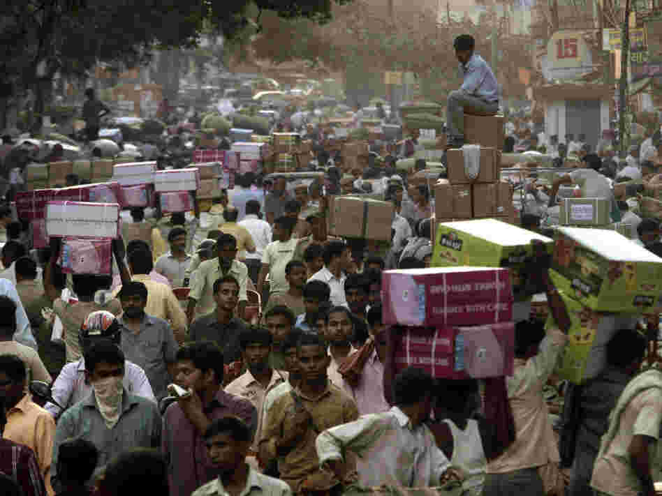 Crowds pack a wholesale market in New Delhi. Already the second most populous country with 1.2 billion people, India is expected to overtake China around 2030.