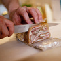 Chef Daniel O'Brien slices the pig ear terrine he made for the "Scary Bits" dinner at his Season Pantry supper club in Washington, D.C. Chef Daniel O'Brien slices the pig ear terrine he made for the "Scary Bits" dinner at his Season Pantry supper club in Washington, D.C.