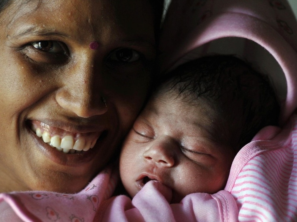 Several babies born today have been deemed the symbolic 7 billionth person — including a little girl named Nargis in Lucknow, India. Here she is with her mother, Vinita.