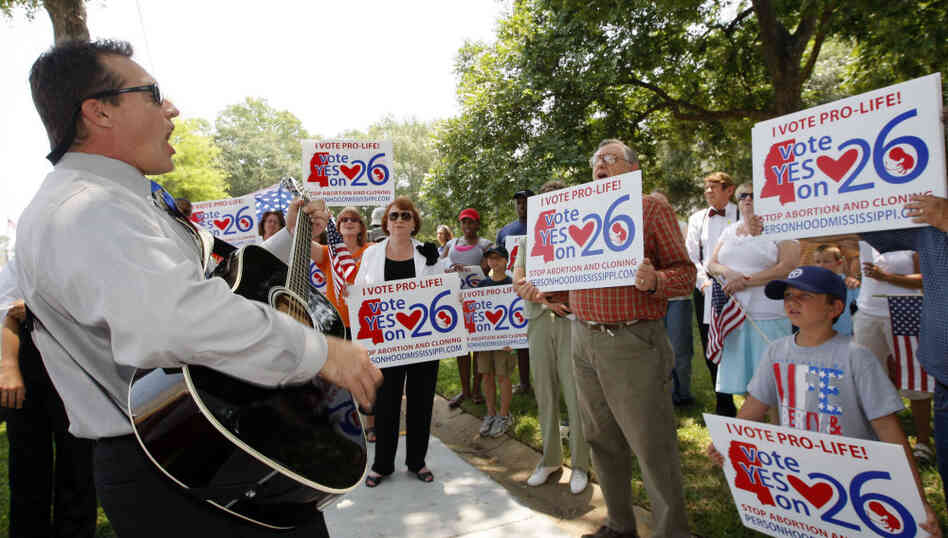 Supporters of a constitutional amendment that says human life begins at the moment of fertilization gather at a prayer rally in Jackson, Miss., in June. Residents will vote on the amendment Nov. 8. Supporters of a constitutional amendment that says human life begins at the moment of fertilization gather at a prayer rally in Jackson, Miss., in June. Residents will vote on the amendment Nov. 8.
