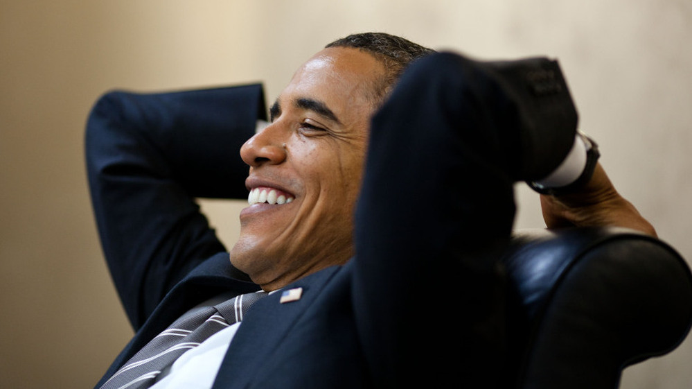 A relaxed and fit President Obama meets with senior advisers at the White House in early July. 