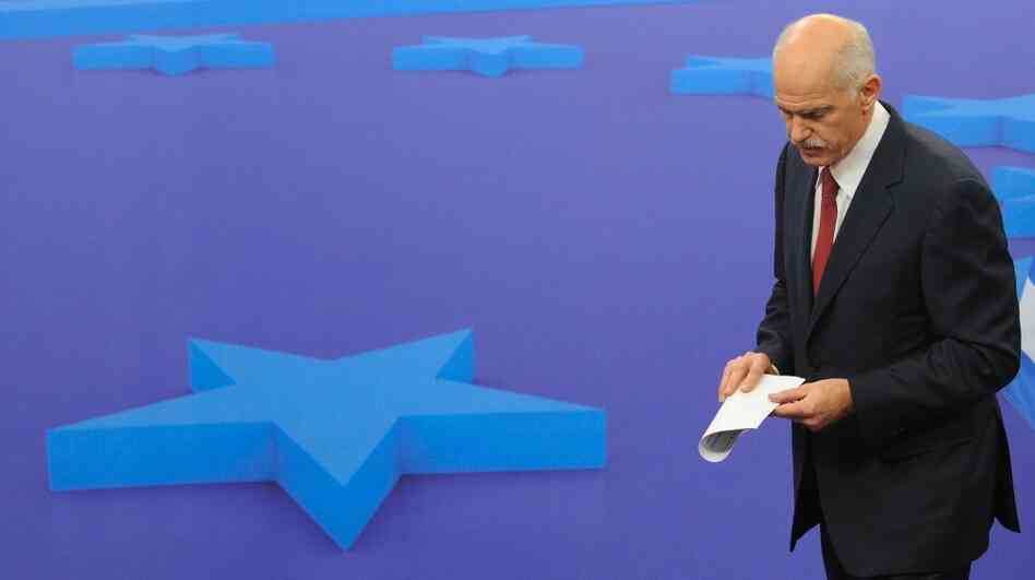 Greek Prime Minister George Papandreou leaves a news conference after a meeting with European Council President Herman Van Rompuy on Oct. 13 at EU headquarters in Brussels. EU leaders were surprised and angered Tuesday when Papandreou said he would place a debt restructuring proposal before Greek voters.