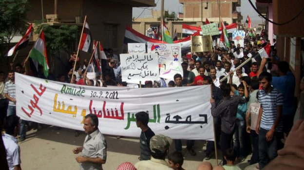 Anti-government protesters march in the village of Amouda, Syria on Sept. 30. For many Syrians, the protests mark the first time they have taken part in anything resembling politics.