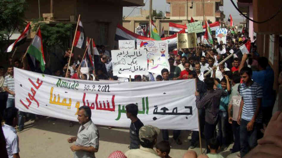 Anti-government protesters march in the village of Amouda, Syria on Sept. 30. For many Syrians, the protests mark the first time they have taken part in anything resembling politics.