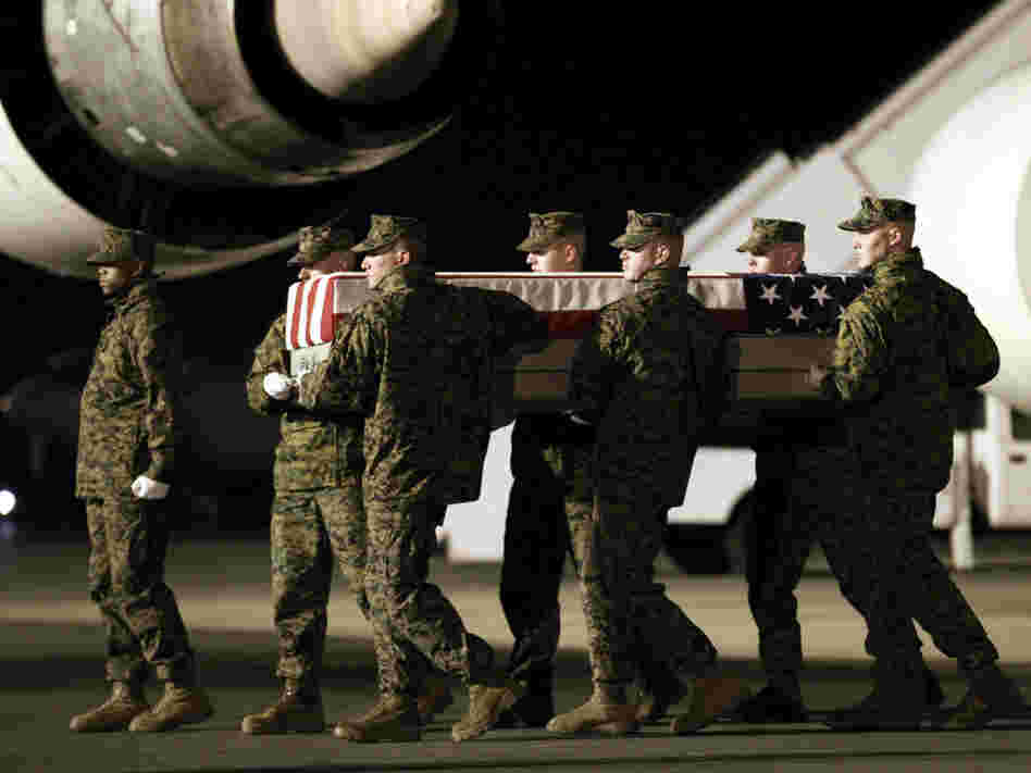 Marines carry the remains of Cpl. Derek Wyatt upon arrival at Dover Air Force Base, Del., on Dec. 8, 2010. He was killed by hostile fire during a deployment to Sangin in southern Afghanistan's Helmand province.