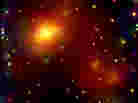 A massive galaxy cluster about 3 billion light years from Earth. A massive galaxy cluster about 3 billion light years from Earth.