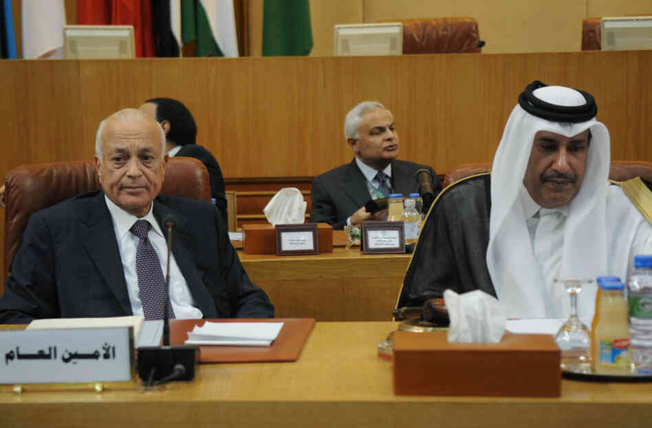 Arab League Secretary General Nabil al-Arabi and Qatari Foreign Minister Hamad bin Jassim listen during a meeting to discuss the situation in Syria, in Cairo on Wednesday. Arab League Secretary General Nabil al-Arabi and Qatari Foreign Minister Hamad bin Jassim listen during a meeting to discuss the situation in Syria, in Cairo on Wednesday.