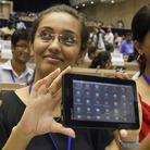 Indian students pose with the supercheap Aakash tablet computers, which they received during the Oct. 5 product launch in New Delhi. The Indian government intends to deliver 10 million tablets to college students across India at a subsidized price of $35.