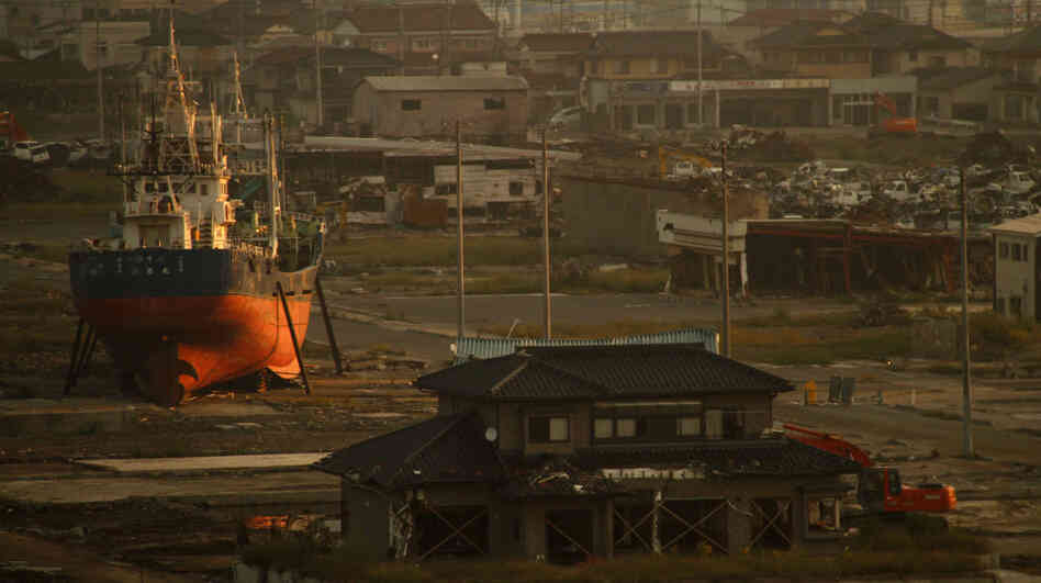 A fishing boat washed ashore by the tsunami that hit Japan March 11 sits in the deserted port area in Kesennuma, Miyagi Prefecture, northeastern Japan, in September. Residents of Kesennuma are now trying to rebuild their town from scratch. A fishing boat washed ashore by the tsunami that hit Japan March 11 sits in the deserted port area in Kesennuma, Miyagi Prefecture, northeastern Japan, in September. Residents of Kesennuma are now trying to rebuild their town from scratch.