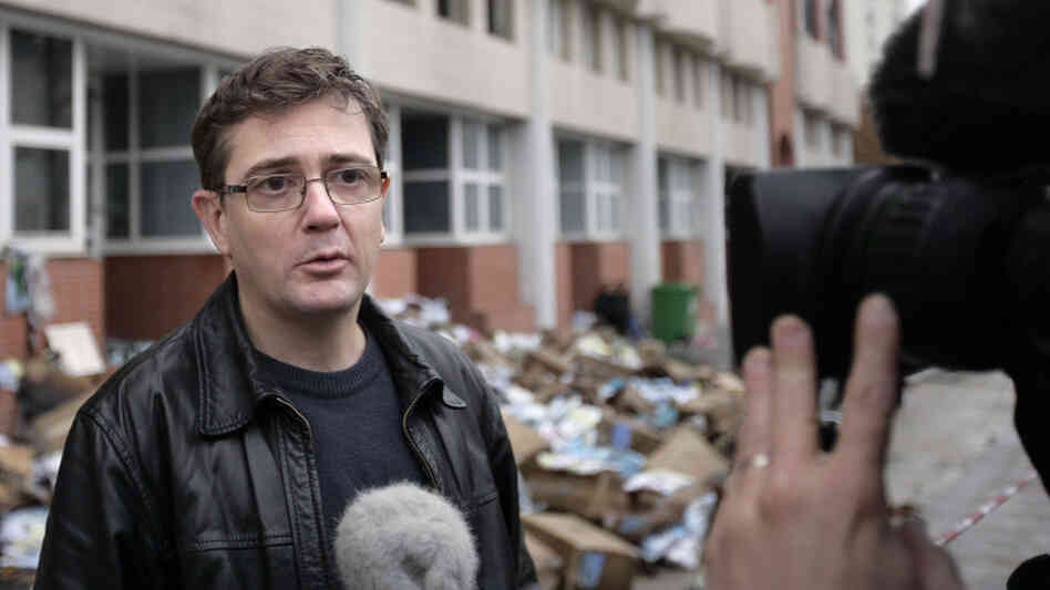 Charlie Hebdo's publisher, known only as Charb, talked to journalists today (Nov. 2, 2011) in front of his publication's burned-out offices. 
