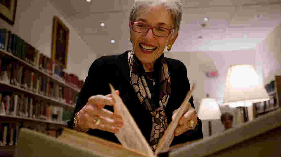 Dava Sobel, who has written a new book about Copernicus, pages through a first edition copy of the astronomer's 1543 work On the Revolutions of the Heavenly Spheres at Dibner Library of the History of Science and Technology at the Smithsonian National Museum of American History in Washington, D.C.