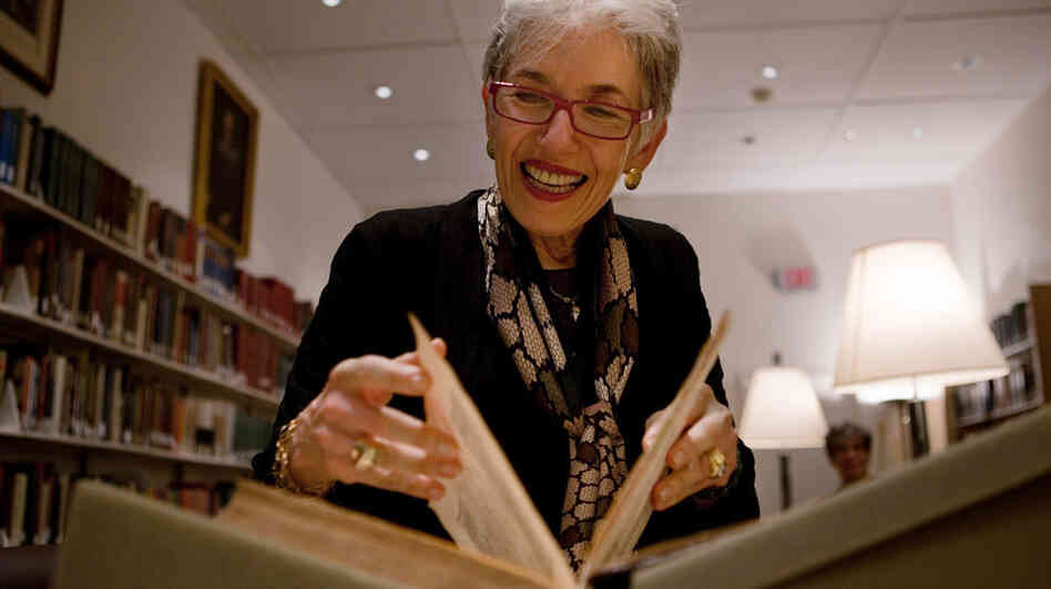 Dava Sobel, who has written a new book about Copernicus, pages through a first edition copy of the astronomer's 1543 work On the Revolutions of the Heavenly Spheres at Dibner Library of the History of Science and Technology at the Smithsonian National Museum of American History in Washington, D.C.