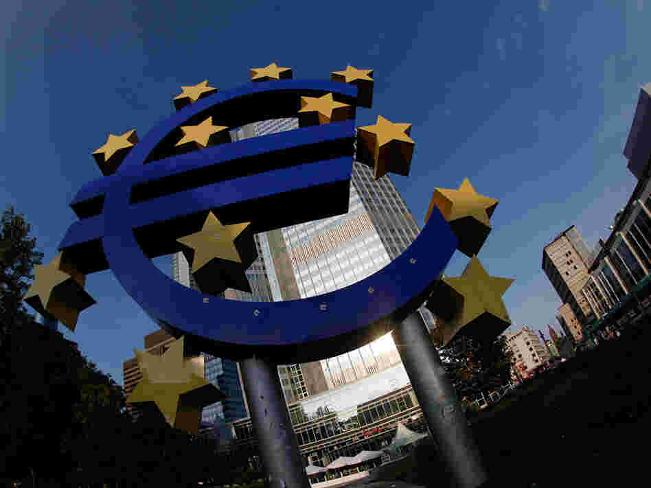 The symbol of the European common currency, the Euro stands at the headquarters of the European Central Bank. The symbol of the European common currency, the Euro stands at the headquarters of the European Central Bank.
