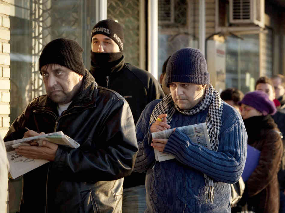 People line up outside an unemployment office in Madrid in February. The country has the eurozone's highest unemployment rate at more than 21 percent.