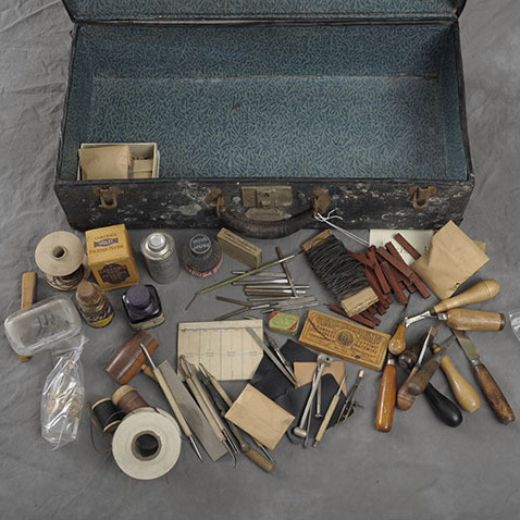 Photographer Jon Crispin photographs suitcases that were left behind at the Willard Psychiatric Center in Willard, N.Y.